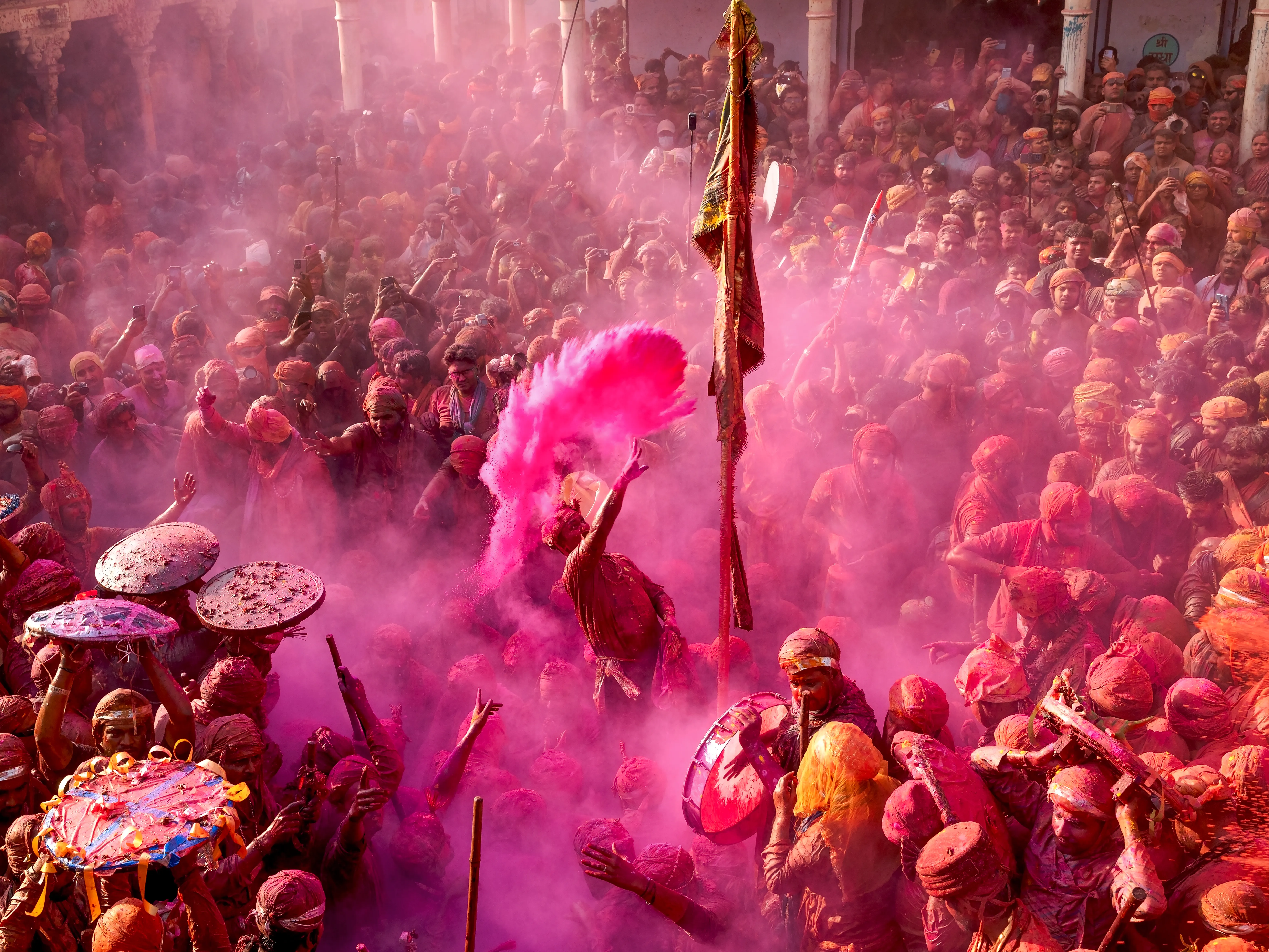 People celebrating Holi, the Indian festival of colours, with vibrant powders.
